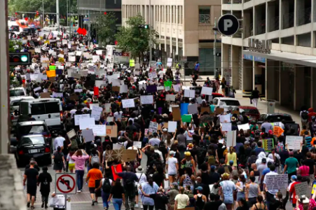 A large group of protesters marching against police violence